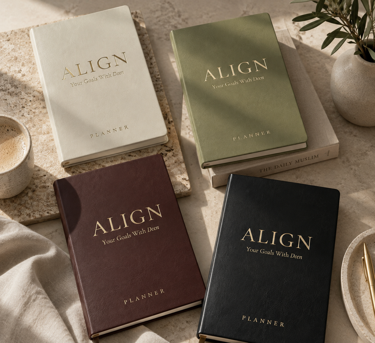 All four Align planners styled together in warm natural light
